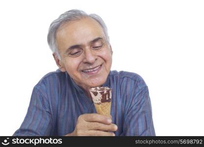 Close-up of senior man looking at ice cream cone