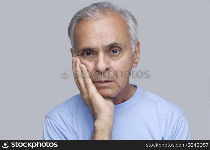 Close-up of serious man with toothache