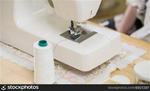 Close-up of sewing machine on table ready