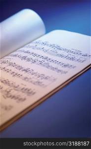 Close-up of sheet music in book