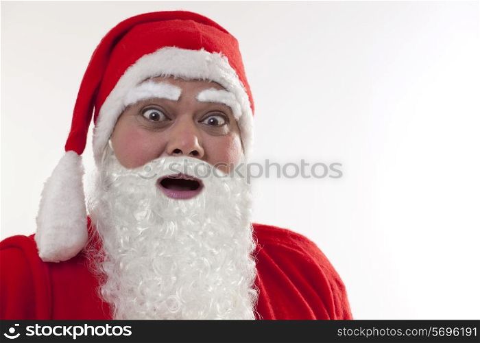 Close up of shocked Santa Claus over white background