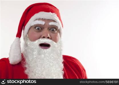 Close up of shocked Santa Claus over white background