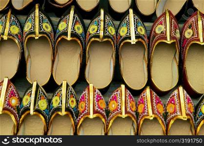 Close-up of shoes hanging at a store in a market, Pushkar, Rajasthan, India
