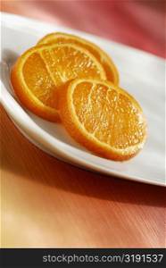 Close-up of slices of orange in a plate