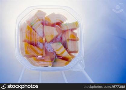 Close-up of slices of papaya in a container
