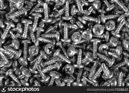Close-up of small screws. Background or texture