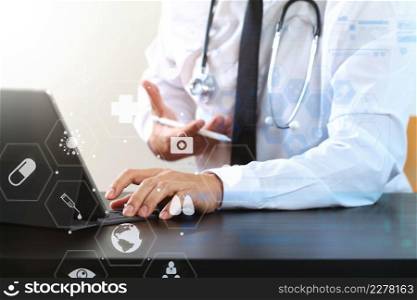 close up of smart medical doctor working with digital tablet computer and stylus pen and stethoscope on dark wooden desk with virtual icon diagram