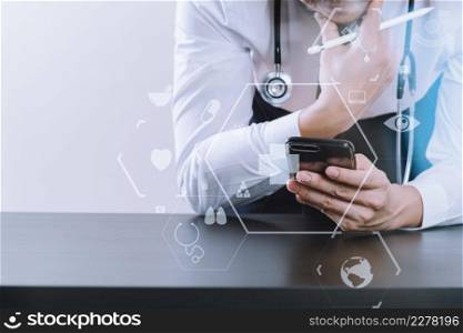 close up of smart medical doctor working with smart phone and stethoscope on dark wooden desk with virtual icon diagram