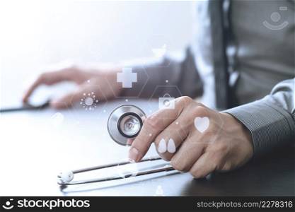 close up of smart medical doctor working with stethoscope and mobile phone on dark wooden desk in modern hospital with virtual reality icon diagram