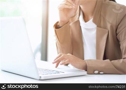 close up of Smart woman working at home office thinking new business project