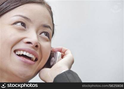 Close Up of Smiling Businesswoman on the Phone in Beijing