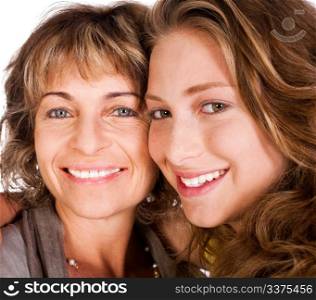 Close-up of smiling elder mum and daughter facing camera...