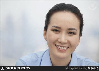 Close-up of smiling young woman, portrait