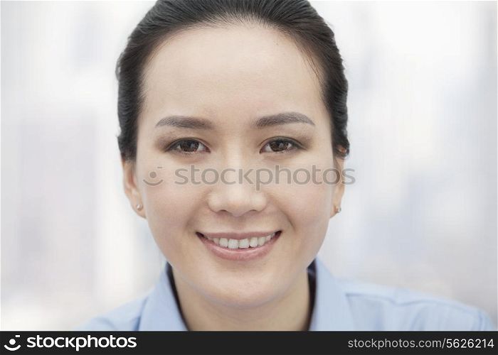Close-up of smiling young woman, portrait