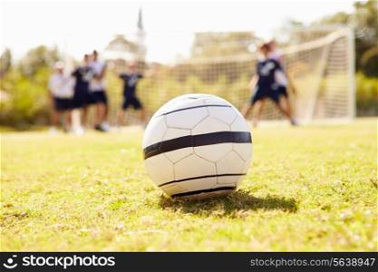 Close Up Of Soccer Ball With Players In Background