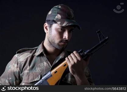 Close-up of soldier holding gun