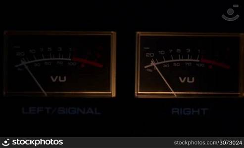 Close up of Sound vu meters overloading then turned off
