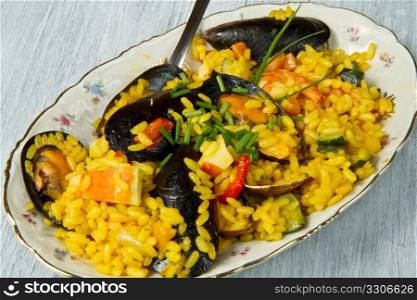 Close-up of Spanish paella on white plate