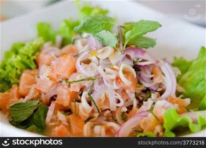 close up of spicy salmon salad with mixed vegetable