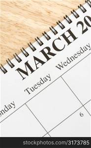 Close up of spiral bound calendar displaying month of March.