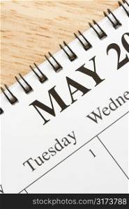Close up of spiral bound calendar displaying month of May.