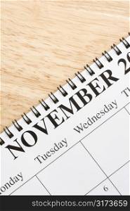 Close up of spiral bound calendar displaying month of November.