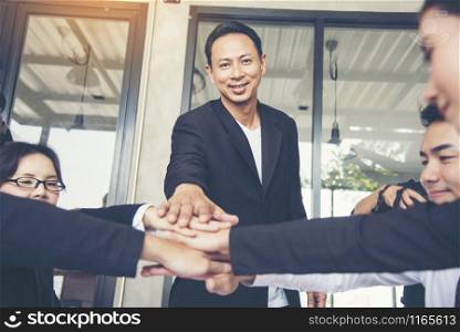 Close up of Stack hands of business people join hand together. Business People Teamwork Collaboration Relation Concept.