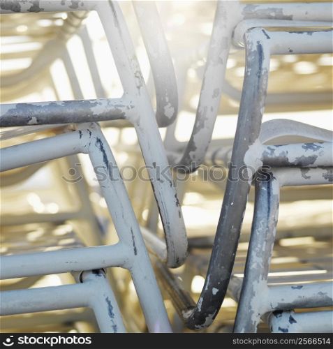 Close-up of stacked worn beach chairs in Miami, Florida, USA.
