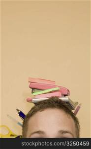 Close-up of stationery objects on a young man&acute;s head
