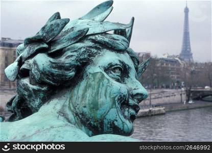 Close up of statue with Eiffel Tower in background, Paris, France