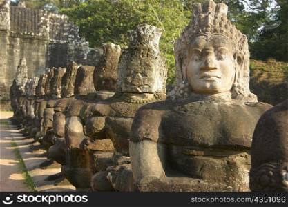 Close-up of statues in a row, Ta Prohm Temple, Angkor Wat, Siem Reap, Cambodia