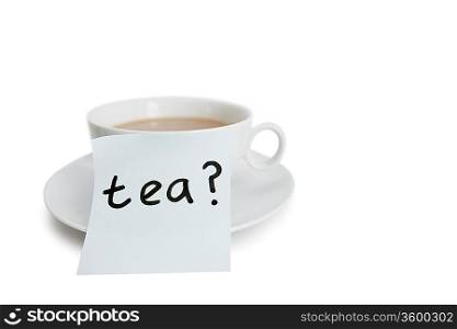 Close-up of sticky notepaper with teacup over white background