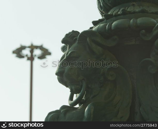 Close up of stone lion under blue sky