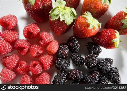 Close-up of strawberries with blackberries and raspberries