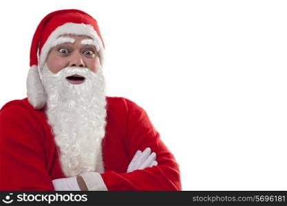 Close-up of surprised Santa Claus with arms folded over white background