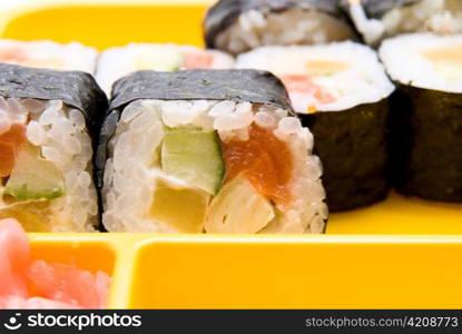 Close up of sushi on yellow plate