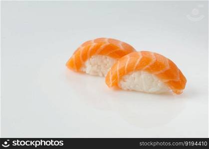 close up of sushi with rice on white background with reflection. sushi on white background