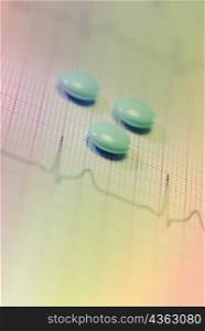 Close-up of tablets on an ECG report