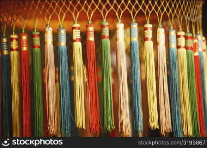 Close-up of tassels hanging from a lantern