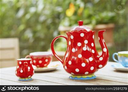 Close-up of tea kettle and teacups