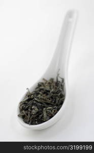 Close-up of tea leaves in a spoon