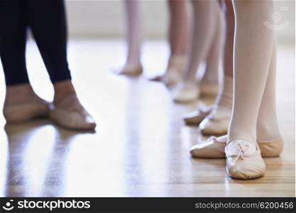 Close Up Of Teacher And Children&rsquo;s Feet In Ballet Dancing Class