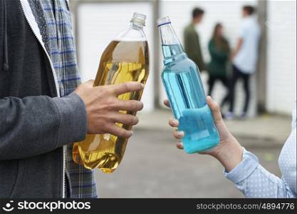 Close Up Of Teenage Group Drinking Alcohol