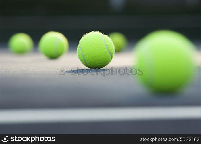 Close-up of tennis balls lying on ground