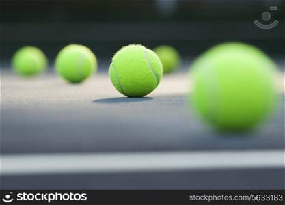 Close-up of tennis balls lying on ground