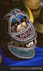 Close-up of thai-style beaded caps and hats