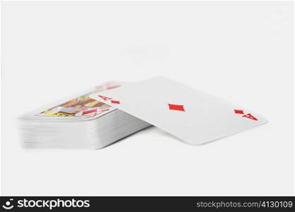 Close-up of the ace of diamonds on a stack of playing cards