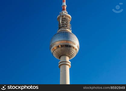 Close up of the Berlin Television Tower, Berliner Fernsehturm against a blue sky, Berlin, Germany