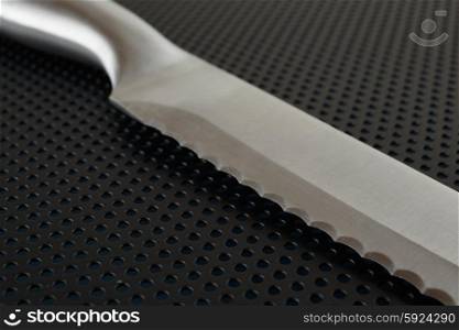 Close up of the blade of stainless steel bread knife