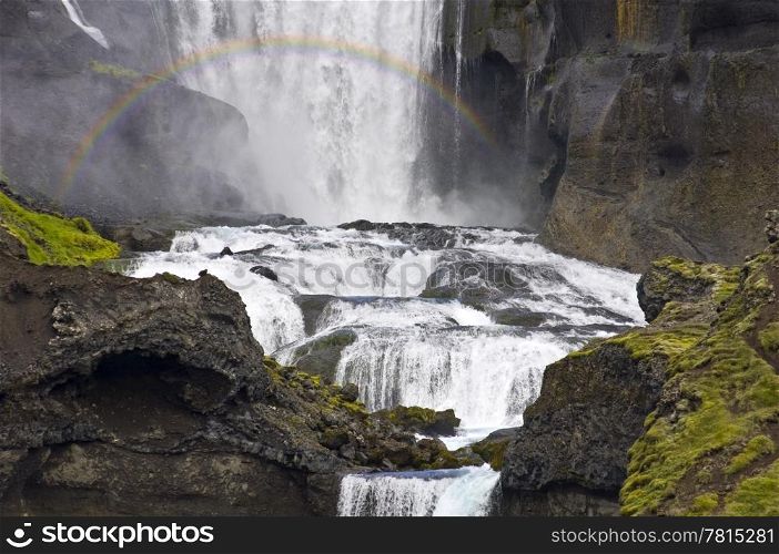 Close up of the Ofaerufoss waterfal in the Eldgja volcanic canyon of Iceland&rsquo;s Landmannalaugar national park with a rainbow in front